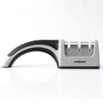 A Four-in-one Family Uses A Sharpener To Sharpen A Kitchen Knife - Image 2