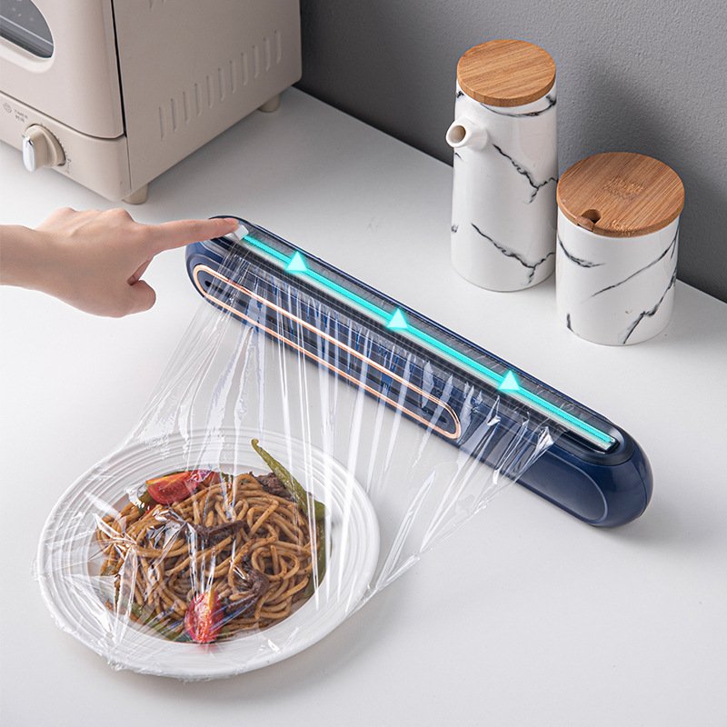 c4cb1dcf-242e-4cb0-81e7-0d13e8261ebb.jpg Creative Can Hang Magnetic Cling Film Cutter For Home Kitchen - Image 1